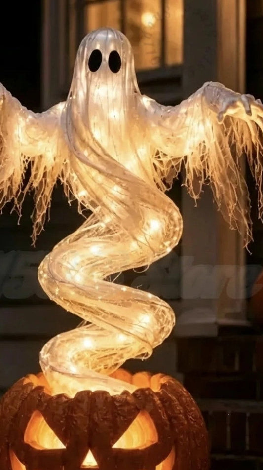 Glowing swirling ghost rising from a jack-o'-lantern